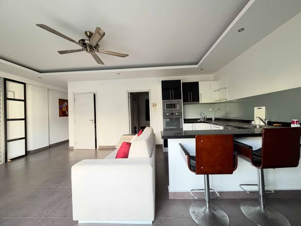 living room and room interior of Tudor Court Condominium