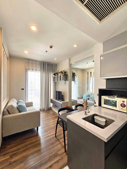 living room and kitchen of WYNE by Sansiri