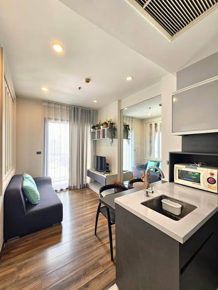 living room and kitchen of WYNE by Sansiri
