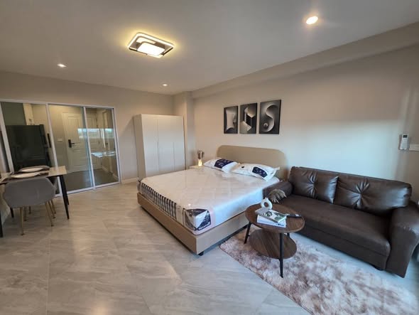 bedroom and living room of 103 Central condominium