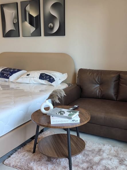 bedroom and living room of 103 Central condominium