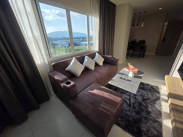 living room and bedroom of 103 Central condominium