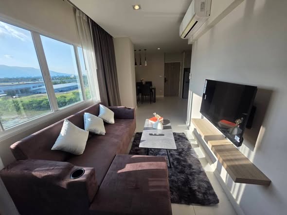 living room and bedroom of 103 Central condominium