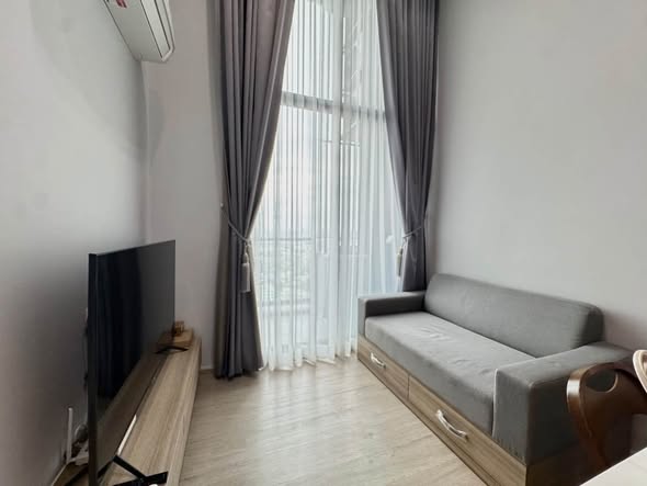 bedroom and living room of Altitude Unicorn Sathorn
