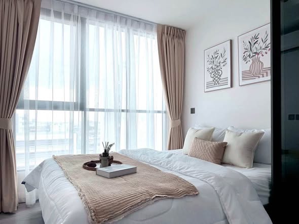 bedroom and living room of Atmoz Palacio Ladprao Wanghin | แอทโมซ พาลาซิโอ ลาดพร้าว วังหิน
