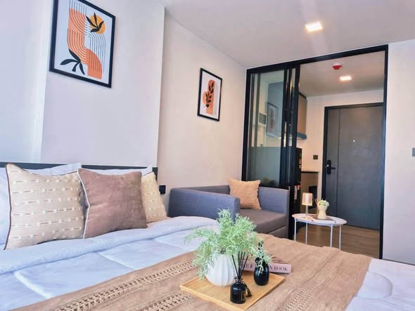 living room and bedroom of Atmoz Palacio Ladprao Wanghin | แอทโมซ พาลาซิโอ ลาดพร้าว วังหิน
