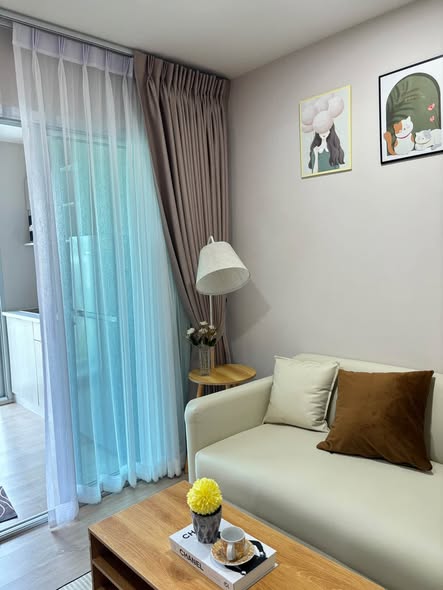 bedroom and living room of BE Condo