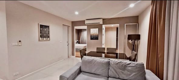 bedroom and living room of อัพเอกมัยคอนโดมิเนียม