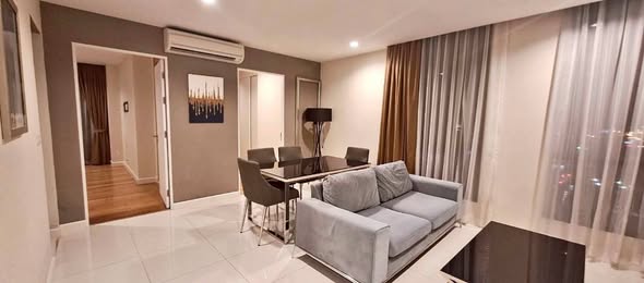 bedroom and living room of อัพเอกมัยคอนโดมิเนียม