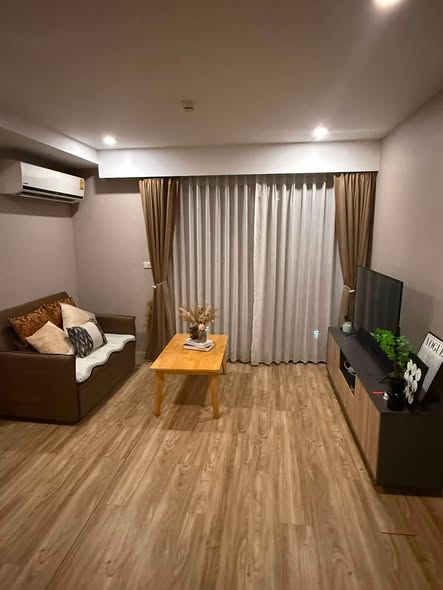 bedroom and living room of Blossom Condo Sathon-Charoen Rat