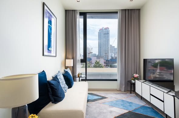 bedroom and living room of Chapter Charoennakhon–Riverside