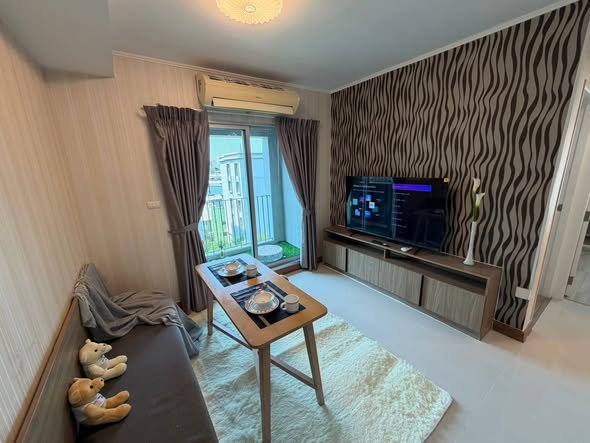 living room and bedroom of Chapter One The Campus Kaset