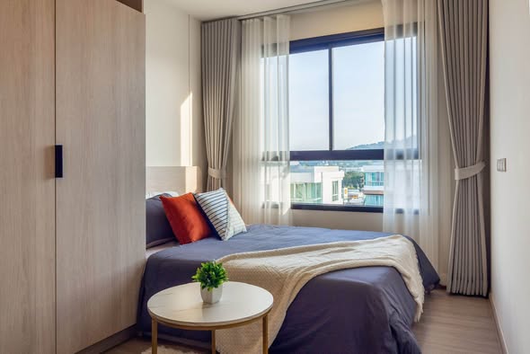 bedroom of dcondo Reef Phuket