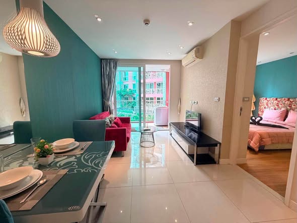 living room and bedroom of Grande Caribbean Condo
