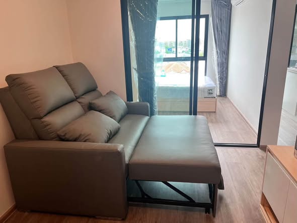 living room and bedroom of HI Kaset-Sena Nikhom Station by AOS
