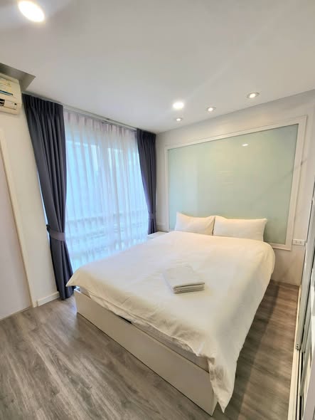 bedroom and room interior of i-House Laguna Garden RCA – Building A (Blue)