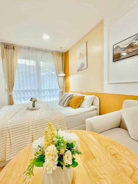 living room and bedroom of i-House Laguna Garden RCA – Building A (Blue)