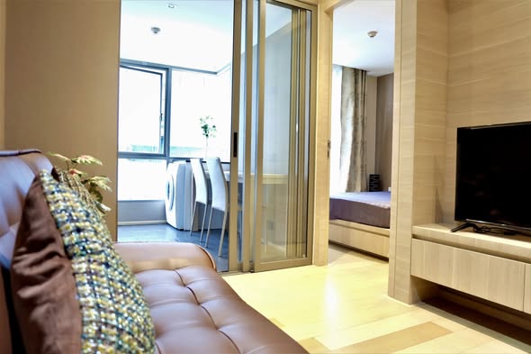 living room and bedroom of Klass Silom Condo