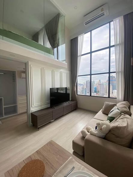 living room and bedroom of KnightsBridge Prime Sathon
