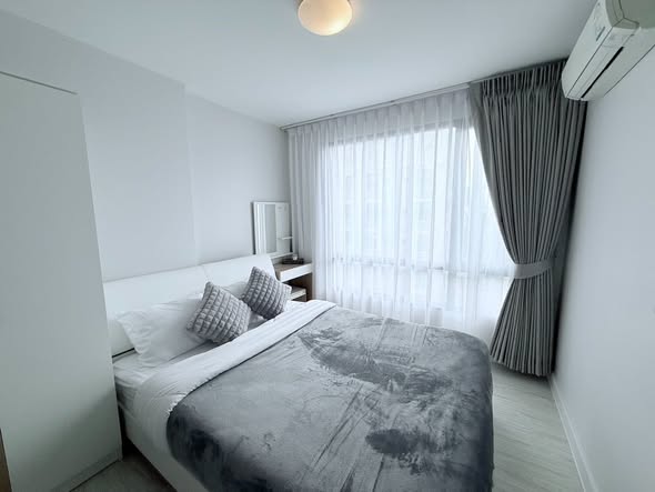 bedroom of L Style Condo