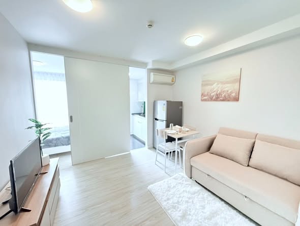 living room and bedroom of L Style Condo