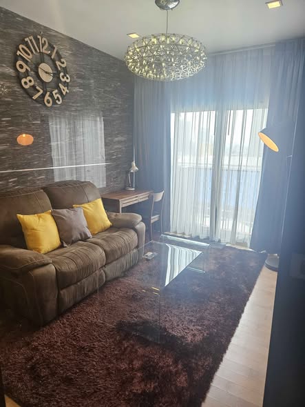 bedroom and living room of Noble Reveal