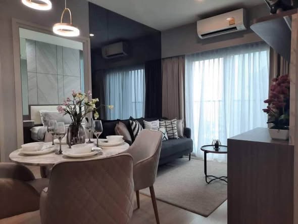 bedroom and living room of Noble Revolve Ratchada 2