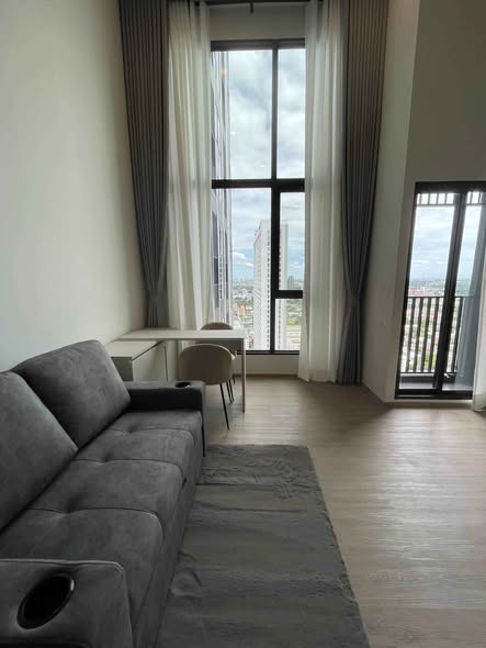 living room and bedroom of Origin Plug & Play Nonthaburi Station