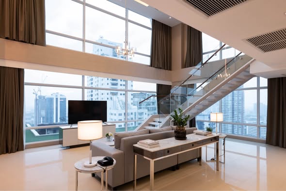 bedroom and living room of Penthouse Condominium 3