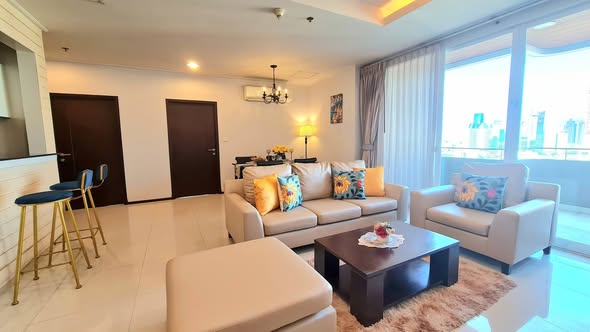 living room and bedroom of Piyathip Place Serviced Apartment