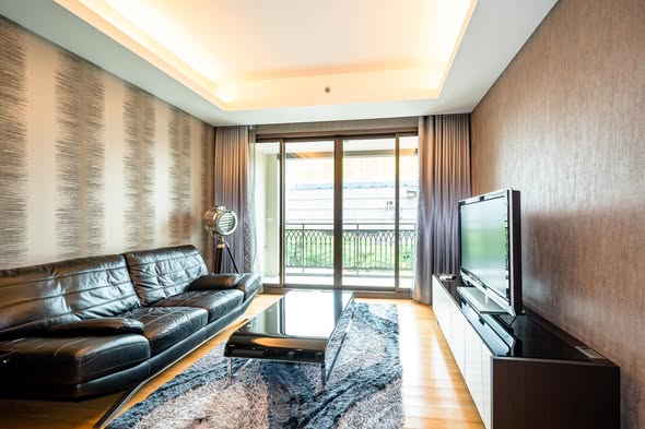 bedroom and living room of Prive by Sansiri