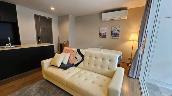 bedroom and living room of Q Prasarnmit