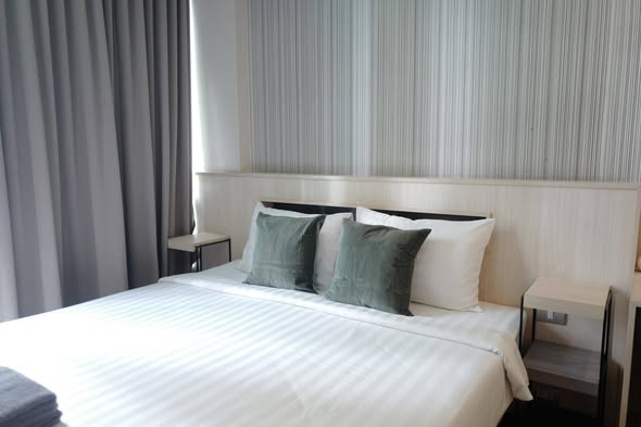 bedroom of Qube Suites Sukhumvit 46
