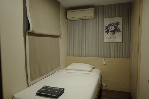 bedroom of Qube Suites Sukhumvit 46