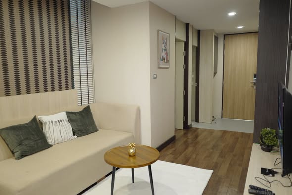 living room and bedroom of Qube Suites Sukhumvit 46