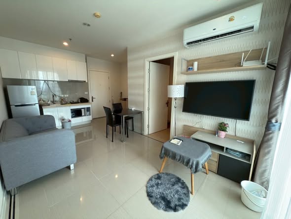 living room and bedroom of TC-Green Condominium
