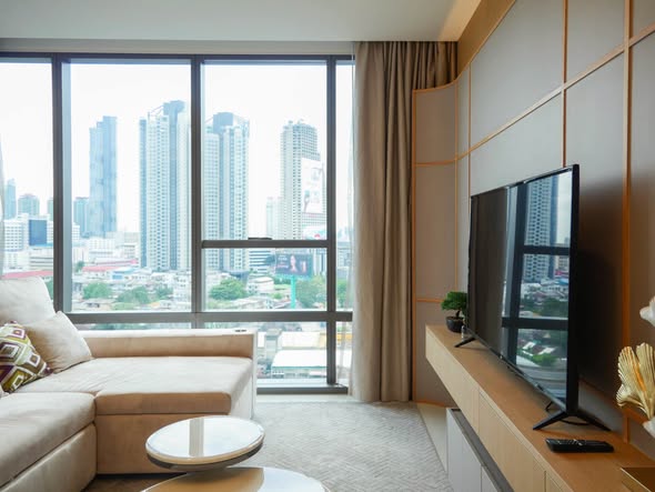 bedroom and living room of The Bangkok Sathorn