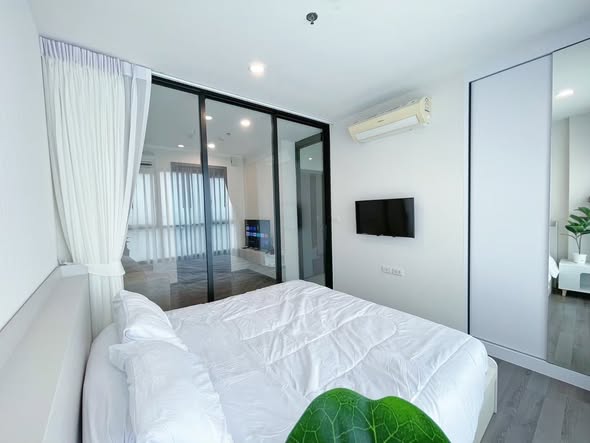 bedroom and room interior of THE BASE Park West – Sukhumvit 77