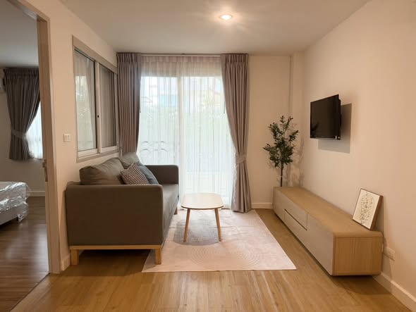 bedroom and living room of The Clover