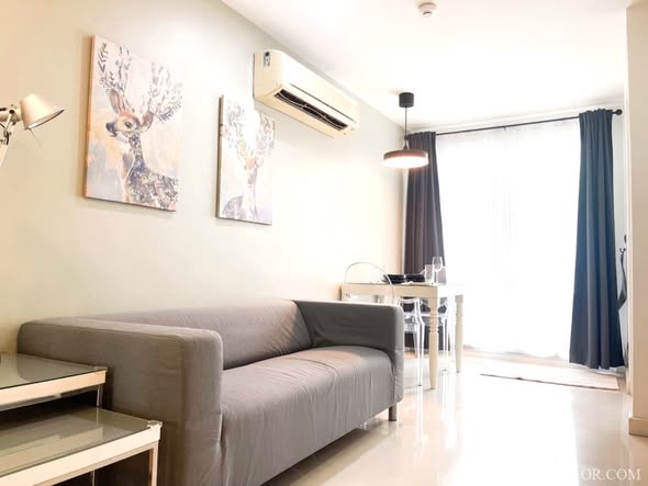 bedroom and living room of The Clover