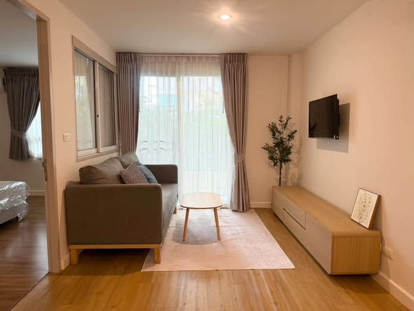 bedroom and living room of The Clover