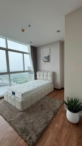 living room and bedroom of The Coast Bangkok