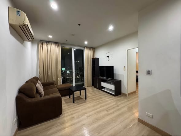 bedroom and living room of The Complete Narathiwas
