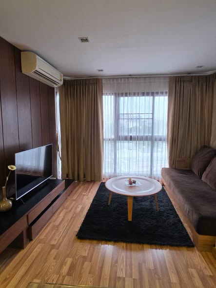 living room and bedroom of The Green Condo III