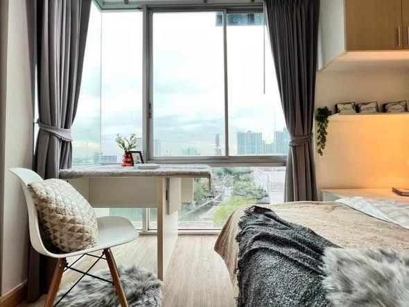 living room and bedroom of The Iris Condo (F Building) Rama 9 – Srinagarindra