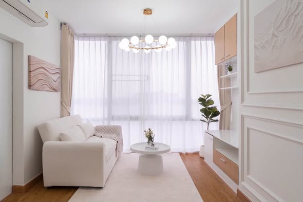 living room and bedroom of The Iris Condo (F Building) Rama 9 – Srinagarindra