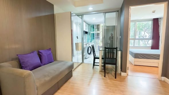 bedroom and living room of The Kris 7