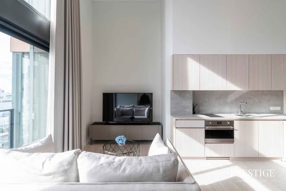 living room and bedroom of The Lofts Silom by Raimon Land