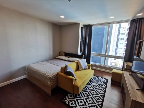 bedroom of The Metropolis Samrong