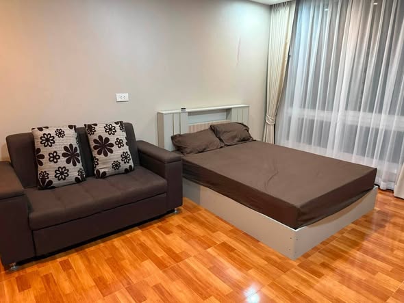 bedroom of The Metropolis Samrong